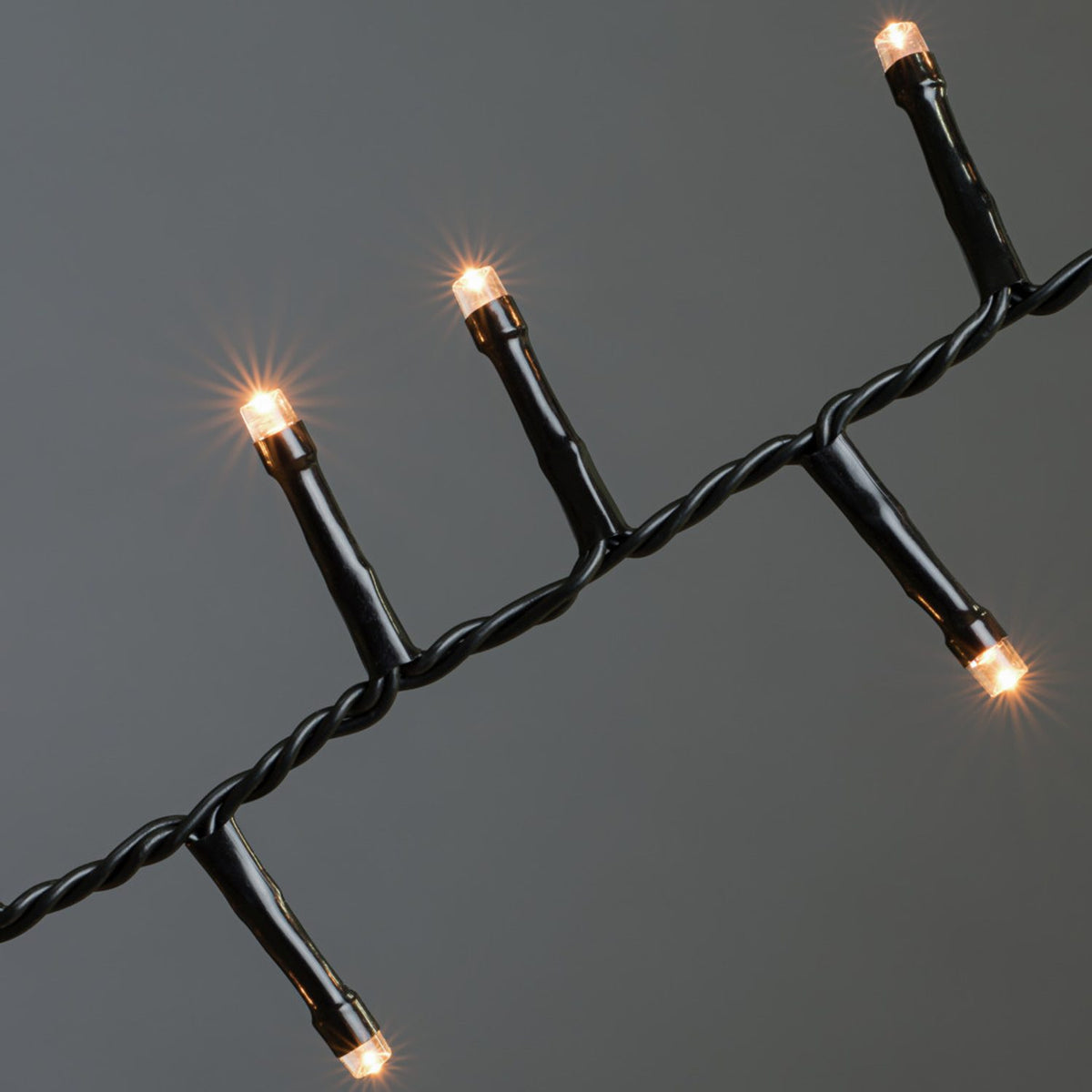 Cluster LED Svart kabel 30V/IP44 Ljusslinga Ute 32.98m, Amber